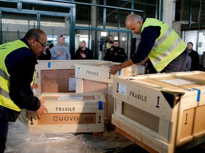 Workers unload boxes of artefacts at Beirut's International Airport, in Beirut, Lebanon January 12, 2018. REUTERS/Mohamed Azakir