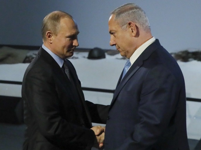 Russian President Vladimir Putin and Israeli Prime Minister Benjamin Netanyahu shake hands as they attend an event marking the International Holocaust Victims Remembrance Day and the 75th anniversary of the breakthrough the Nazi Siege of Leningrad in the World War II, at the Jewish Museum and Tolerance Centre in Moscow, Russia January 29, 2018. REUTERS/Maxim Shemetov