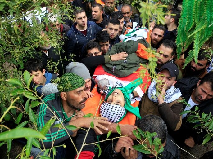 ATTENTION EDITORS - VISUAL COVERAGE OF SCENES OF INJURY OR DEATH Mourners carry the body of a 16-year-old Palestinian during his funeral at the village of Bureen near the West Bank city of Nablus January 12, 2018. REUTERS/Abed Omar Qusini TEMPLATE OUT