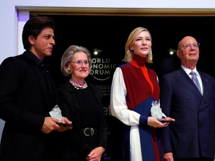 Actor Cate Blanchett and actor Shah Rukh Khan pose for the media after receiving the Crystal Awards, with Hilde Schwab, Chairperson and Co-Founder, Schwab Foundation for Social Entrepreneurship and Klaus Schwab, Founder and Executive Chairman of the WEF, at the annual meeting of the World Economic Forum (WEF) in Davos, Switzerland January 22, 2018. REUTERS/Denis Balibouse