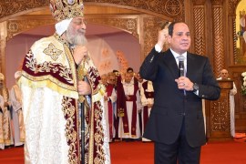 Egyptian Coptic Pope Tawadros II (L), Pope of Alexandria and Patriarch of Saint Marc Episcopate receives Egyptian President Abdel Fattah al-Sisi (R), at the new Coptic Cathedral at the new Coptic Cathedral