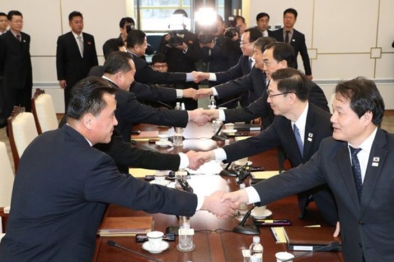 South and North Korean delegations attend their meeting at the truce village of Panmunjom in the demilitarised zone separating the two Koreas, South Korea, January 9, 2018. Yonhap via REUTERS ATTENTION EDITORS - THIS IMAGE HAS BEEN SUPPLIED BY A THIRD PARTY. SOUTH KOREA OUT. NO RESALES. NO ARCHIVE