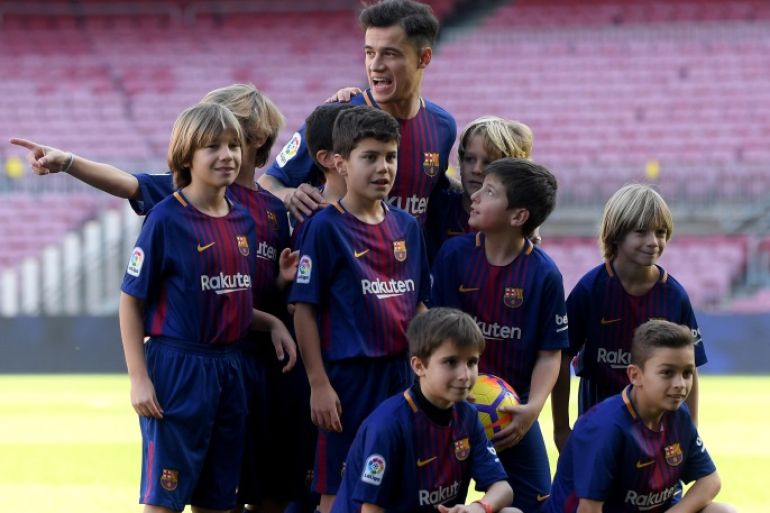 BARCELONA, SPAIN - JANUARY 08: New Barcelona signing Philippe Coutinho poses for a photo with a group of mascots as he is unveiled at Camp Nou on January 8, 2018 in Barcelona, Spain. The Brazilian player signed from Liverpool, has agreed a deal with the Catalan club until 2023 season. (Photo by David Ramos/Getty Images)
