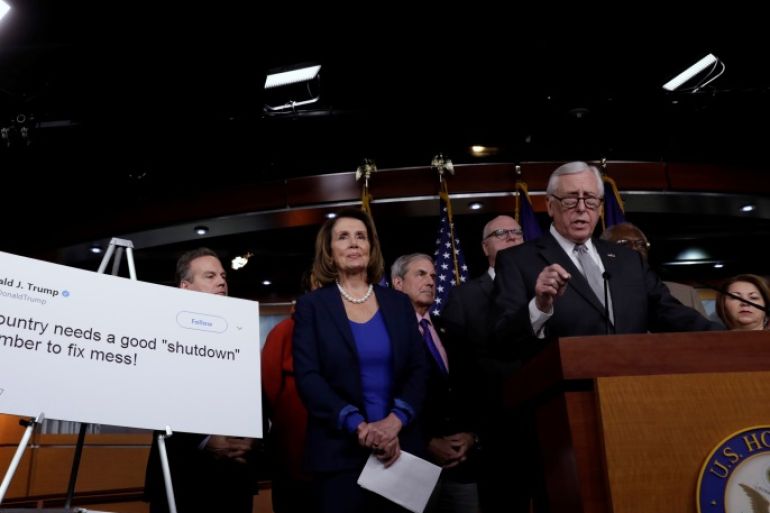 Rep. Steny Hoyer (D-MD) speaks next to House Minority Leader Nancy Pelosi (D-CA) (C) at a news conference with Democratic leaders on opposition to government shutdown on Capitol Hill in Washington, U.S., January 19, 2018. REUTERS/Yuri Gripas