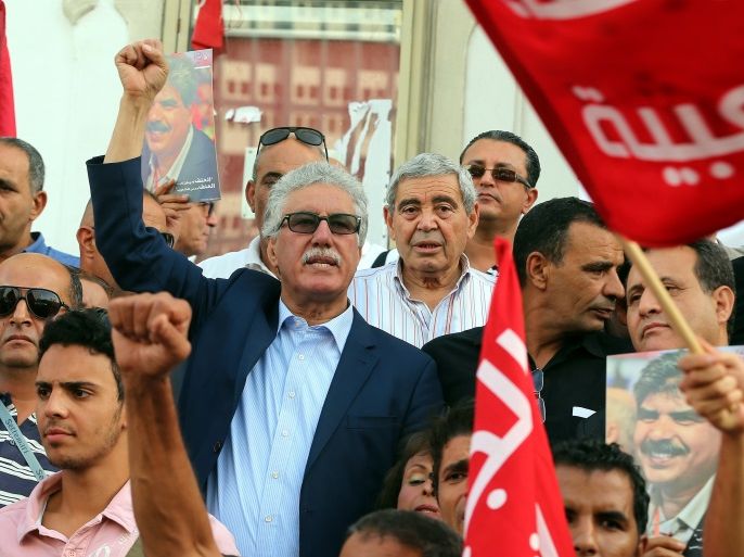 epa05586908 Tunisian leader of Popular Front party, Hamma Hammami (C), takes part in a rally called by the opposition against austerity in Tunis, Tunisia, 15 October 2016. The austerity budget presented by the Government, prior to its consideration in Parliament. EPA/MOHAMED MESSARA