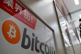 A logo of Bitcoin is seen on an advertisement of an electronic shop in Tokyo, Japan September 5, 2017. REUTERS/Kim Kyung-Hoon
