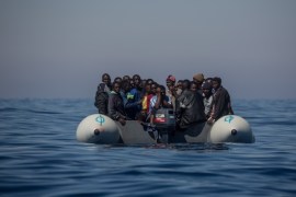 LAMPEDUSA, ITALY - MAY 18: Refugees and migrants are seen floating in an overcrowded rubber boat as they wait to be assisted by search and rescue crew members from the Migrant Offshore Aid Station (MOAS) Phoenix vessel on May 18, 2017 in the Lampedusa, Italy. Numbers of refugees and migrants attempting the dangerous central Mediterranean crossing from Libya to Italy has risen since the same time last year with more than 43,000 people recorded so far in 2017. MOAS is a M