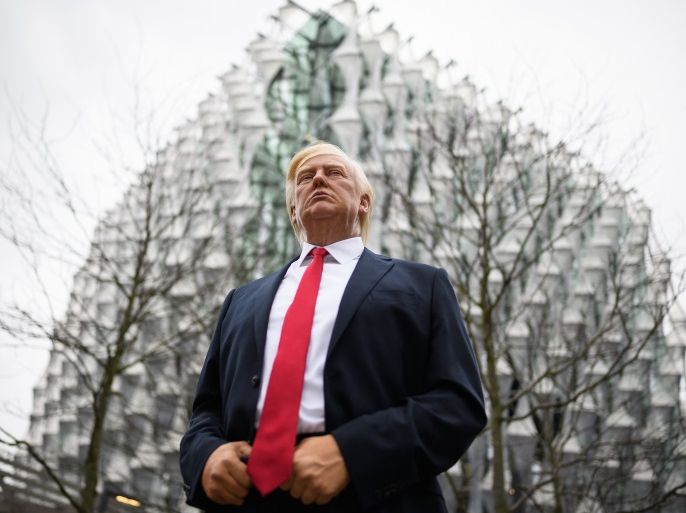 LONDON, ENGLAND - JANUARY 12: A model of US President Donald Trump from the Madame Tussaud's waxwork attraction stands outside the new US embassy on January 12, 2018 in London, England. President Trump has tweeted that he will not go ahead with his planned visit to the new billion-dollar embassy, blaming previous President Barack Obama's 'bad' embassy deal as his reason for cancelling. Critics have speculated that Mr Trump could have been wary of protests and demonstrations if he chose to go ahead with his February visit. (Photo by Leon Neal/Getty Images)