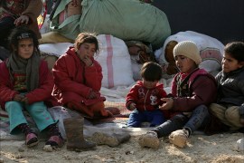 epa06421094 Internally displaced children gather at the Kalbeed makeshift camp, near Bab al-Hawa crossing by the Syrian-Turkish border, 06 January 2018. Hundreds of families fled the fighting between government and opposition forces around Idlib. EPA-EFE/ZEIN ALRIFAII