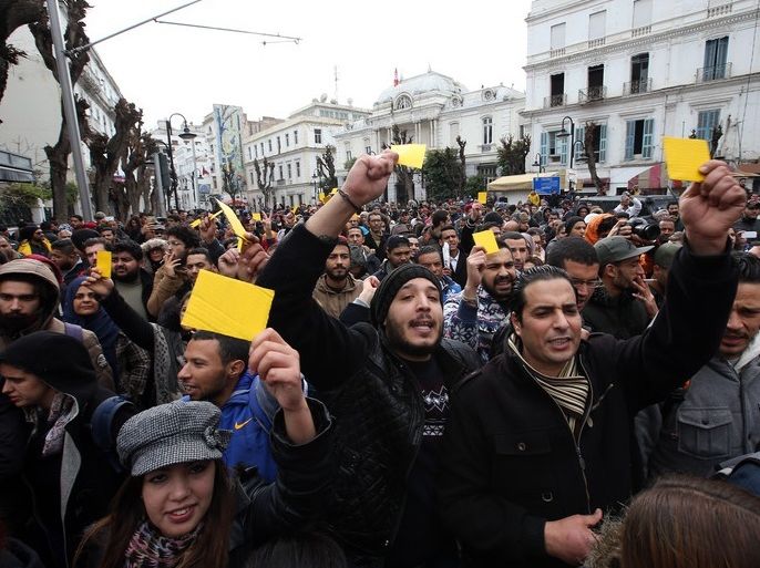 epa06433395 Tunisian protesters shout slogans during a demonstration after the government announced tax hikes and austerity measures and against increased prices of some goods in Tunis, Tunisia, 12 January 2018. Protests were held across Tunisia since 08 January after a the new year's price and tax increase came into effect on 01 January 2018. EPA-EFE/MOHAMED MESSARA