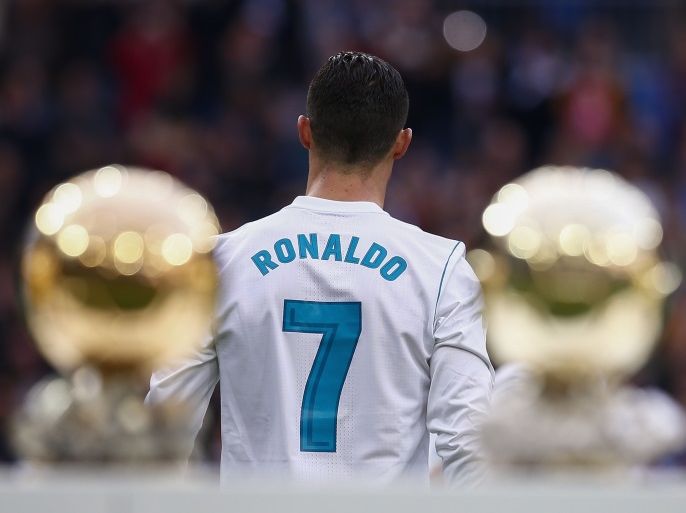 MADRID, SPAIN - DECEMBER 09: Cristiano Ronaldo of Real Madrid CF walks to the pitch after posing with his five Golden Ball (Ballon d'Or) trophies prior to start the La Liga match between Real Madrid CF and Sevilla FC at Estadio Santiago Bernabeu on December 9, 2017 in Madrid, Spain . (Photo by Gonzalo Arroyo Moreno/Getty Images)
