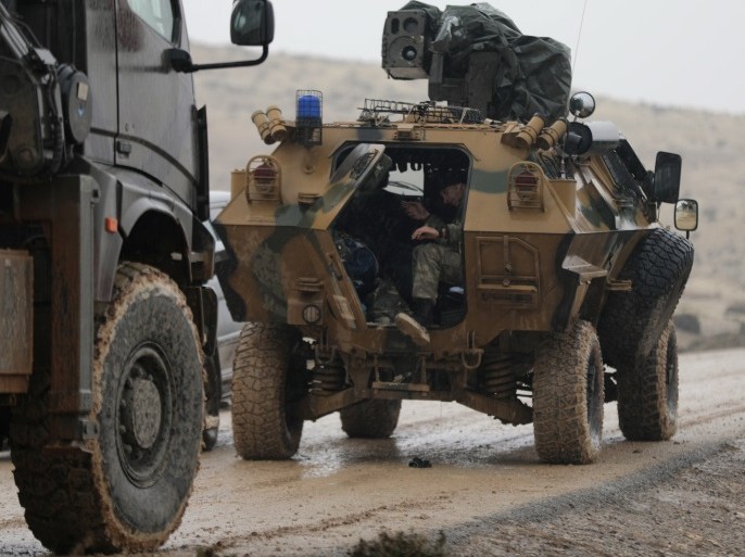 Turkish forces are seen near Mount Barsaya, northeast of Afrin, Syria January 23, 2018. REUTERS/Khalil Ashawi