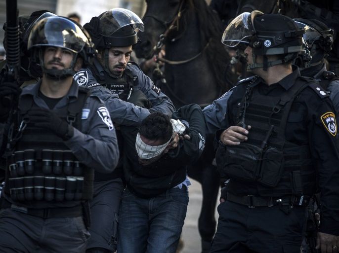 JERUSALEM, ISRAEL - DECEMBER 09: Israeli police forces arrest a Palestinian protester on December 9, 2017 in Jerusalem, Israel. Protest in Jerusalem, West Bank and Gaza continue into the fourth day following U.S. President Donald Trump's decision to recognize Jerusalem as Israel's capital.. (Photo by Ilia Yefimovich/Getty Images)
