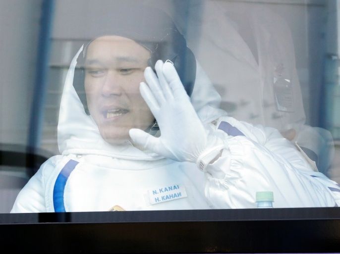 Japanese astronaut Norishige Kanai, member of the main crew of the expedition to the International Space Station (ISS), waves from a bus prior the launch of Soyuz MS-07 space ship at the Russian leased Baikonur cosmodrome, Kazakhstan, Sunday, Dec. 17, 2017. REUTERS/Dmitri Lovetsky/Pool