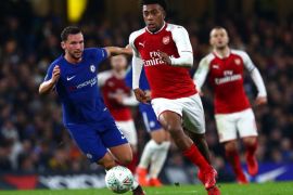 LONDON, ENGLAND - JANUARY 10: Alex Iwobi of Arsenal runs past Danny Drinkwater of Chelsea during the Carabao Cup Semi-Final First Leg match between Chelsea and Arsenal at Stamford Bridge on January 10, 2018 in London, England. (Photo by Clive Rose/Getty Images)