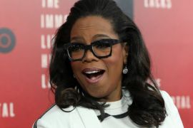 Oprah Winfrey smiles at the premiere of