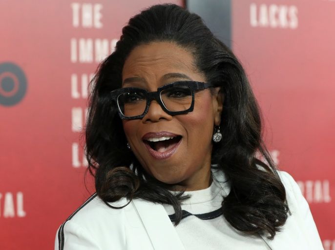 Oprah Winfrey smiles at the premiere of