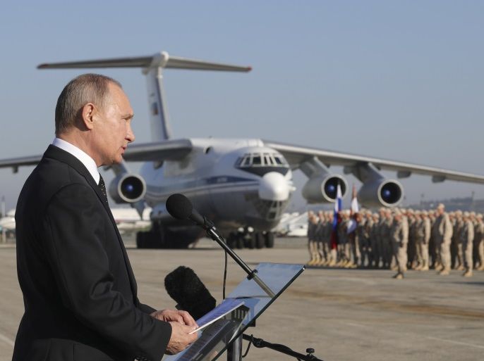 FILE PHOTO: Russian President Vladimir Putin addresses servicemen as he visits the Hmeymim air base in Latakia Province, Syria December 11, 2017. Sputnik/Mikhail Klimentyev/Sputnik via REUTERS ATTENTION EDITORS - THIS IMAGE WAS PROVIDED BY A THIRD PARTY/File Photo