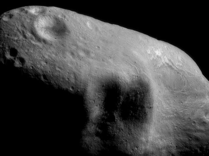 385446 01: FILE PHOTO: An image mosaic of the asteroid Eros, with sunlight coming from the northeast, taken by the robotic NEAR Shoemaker space probe March 3, 2000 from a distance of 204 kilometers, or 127 miles. After a year of circling and taking pictures, NEAR will touch down on asteroid Eros February 12, 2001, to capture surface details, which will be the first time any craft has tried to land on a tumbling space rock. (Photo Courtesy of NASA/Newsmakers)