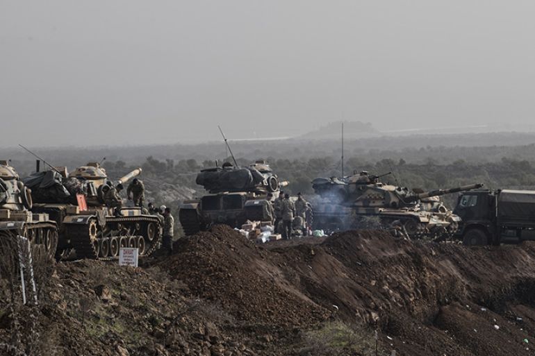 epa06463972 Turkish soldiers prepare their tanks before crossing the Syrian-Turkish border, at the Hassa district on the Turkish-Syrian border in Hatay, Turkey, 22 January 2018. According to media reports, the Turkish army is preparing to conduct an operation (named 'Operation Olive Branch') in Syria's northern regions against the Kurdish Popular Protection Units (YPG) forces which control the city of Afrin. According to YPG media channels, bombings by the Turkish military killed at least 10 people earlier on the same day. Turkey classifies the YPG as a terrorist organization. EPA-EFE/SEDAT SUNA