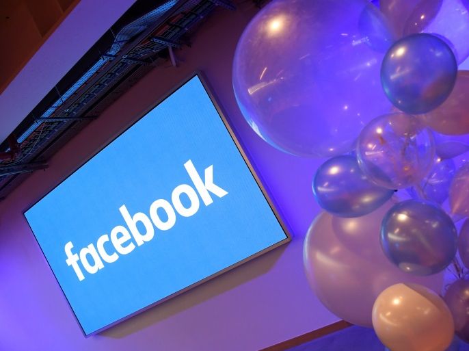 Balloons are seen in front of a logo at Facebook's headquarters in London, Britain, December 4, 2017. REUTERS/Toby Melville