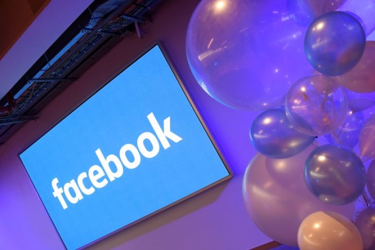 Balloons are seen in front of a logo at Facebook's headquarters in London, Britain, December 4, 2017. REUTERS/Toby Melville