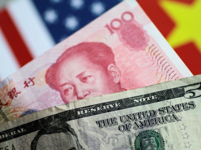 U.S. Dollar and China Yuan notes are seen in this picture illustration June 2, 2017. REUTERS/Thomas White/Illustration