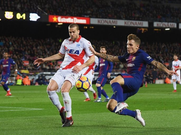 BARCELONA, SPAIN - JANUARY 28: Lucas Digne of Barcelona battles for posession with Víctor Laguardia of Alaves during the La Liga match between Barcelona and Deportivo Alaves at Camp Nou on January 28, 2018 in Barcelona, . (Photo by David Ramos/Getty Images)
