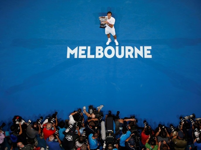 Tennis - Australian Open - Men's singles final - Rod Laver Arena, Melbourne, Australia, January 28, 2018. Switzerland's Roger Federer poses with the trophy after winning the final against Croatia's Marin Cilic. REUTERS/Toru Hanai TPX IMAGES OF THE DAY