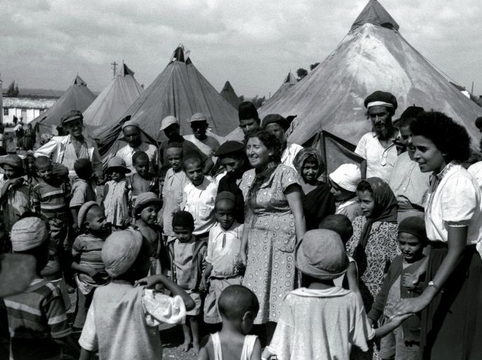FILE PHOTO 1OCT49 - Jewish immigrants from Yemen in a tent encampment in 1949 as they are visited by Israeli nurses. Many Jewish immigrants of Sephardic origin from North Africa and the Middle East were shipped to Israeli development town when they arrived, while many of the European, or Ashkenazi, immigrants were able to start their new lives in Israel's cities with promising jobs. Most of the Yemenites arrived in Israel during