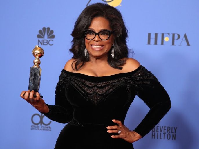 75th Golden Globe Awards – Photo Room – Beverly Hills, California, U.S., 07/01/2018 – Oprah Winfrey poses backstage with her Cecil B. DeMille Award. REUTERS/Lucy Nicholson