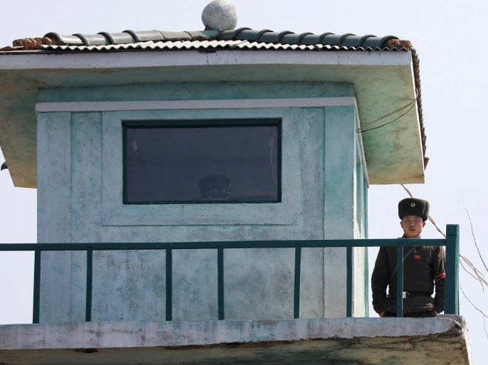 A North Korean soldier looks from a watchtower on the banks of the Yalu River, just north of Sinuiju, North Korea, March 31, 2017. REUTERS/Damir Sagolj SEARCH