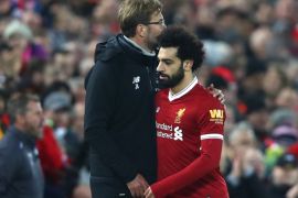 LIVERPOOL, ENGLAND - DECEMBER 30: Jurgen Klopp, Manager of Liverpool greets Mohamed Salah of Liverpool after he is substituted off during the Premier League match between Liverpool and Leicester City at Anfield on December 30, 2017 in Liverpool, England. (Photo by Clive Brunskill/Getty Images)