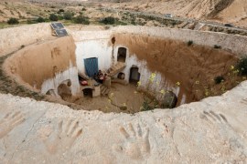 Saliha Mohamedi, 36, sits with her children at their troglodyte house on the outskirts of Matmata, Tunisia, February 4, 2018.