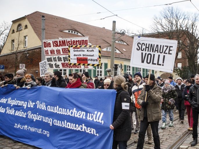 COTTBUS, GERMANY - FEBRUARY 03: A participant holds a sign 'I'm fed up' in an event organized by the right-wing group 'Zukunft Heimat' (Homeland Future), gather to protest against the high number of mostly Muslim refugees who have moved to Cottbus over the past two years on February 3, 2018 in Cottbus, Germany. State authorities recently halted sending newly-arrived refugees to Cottbus following heightened tensions in the city. In one incident a Syrian teenager wa