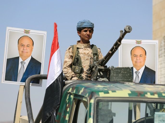A police trooper mans a machine gun mounted on a patrol truck securing a street where people loyal to Yemen's President Abd-Rabbu Mansour Hadi demonstrated to show support to Hadi in the country's northern city of Marib November 3, 2016. REUTERS/Ali Owidha