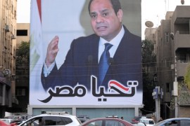 Cars pass by a poster of Egypt's President Abdel Fattah al-Sisi for the upcoming presidential election, in Cairo, Egypt, February 19, 2018. The writing on the poster reads:
