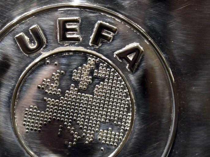 NYON, SWITZERLAND - JULY 18: The UEFA logo is seen on the UEFA Champions League trophy as it is prepared for the UEFA 2014/15 Champions League third qualifying rounds draw at the UEFA headquarters, The House of European Football, on July 18, 2014 in Nyon, Switzerland. (Photo by Harold Cunningham/Getty Images for UEFA)