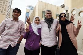 Human rights activist Nabeel Rajab (2nd R) poses with his wife Sumaiya (R), his daughter Malak (2nd L) and his son Adam as they arrive at court for his appeal hearing in Manama, February 11, 2015. Bahrain had sentenced Rajab, one of the highest-profile democracy campaigners in the Arab world, to six months in jail last month over remarks critical of the state, according to the Twitter accounts of his lawyer and the public prosecutor. REUTERS/Hamad Mohammed (BAHRAIN - Tags: POLITICS CIVIL UNREST CRIME LAW)