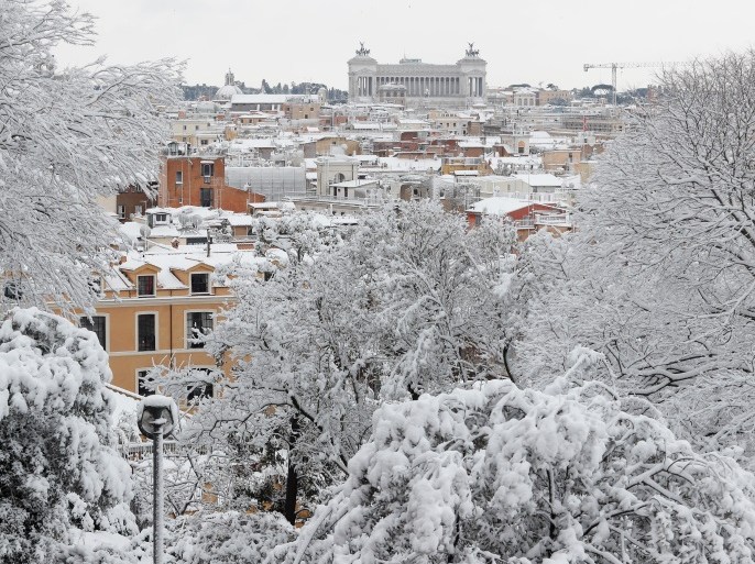 Roofs are seen covered in snow during a heavy snowfall in downtown Rome, Italy February 26, 2018. REUTERS/Remo Casilli