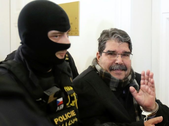 Kurdish Democratic Union Party (PYD) former leader Saleh Muslim is escorted to a Czech court, which will rule on his custody pending extradition proceedings requested by Turkey, in Prague, Czech Republic, February 27, 2018. REUTERS/David W Cerny