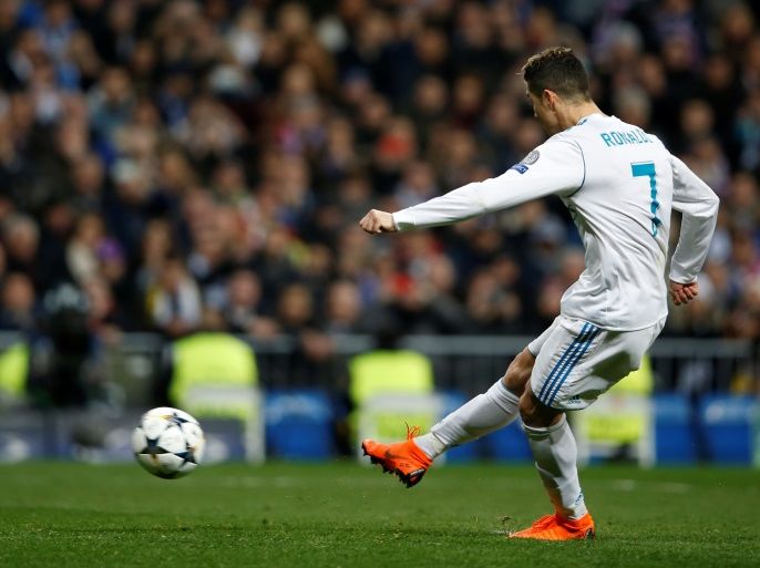 Soccer Football - Champions League Round of 16 First Leg - Real Madrid vs Paris St Germain - Santiago Bernabeu, Madrid, Spain - February 14, 2018 Real Madrid’s Cristiano Ronaldo scores their first goal from the penalty spot REUTERS/Stringer