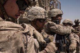 CAMP SHORAB, AFGHANISTAN - SEPTEMBER 10: Members of the United States Marine Corp Task Force South West prepare for a patrol of their base on September 10, 2017 at Camp Shorab in Helmand Province, Afghanistan. About 300 marines are currently deployed in Helmand Province in a train, advise, and assist role supporting local Afghan security forces. Currently the United States has about 11,000 troops in the deployed in Afghanistan, with a reported 4,000 more expected to ar