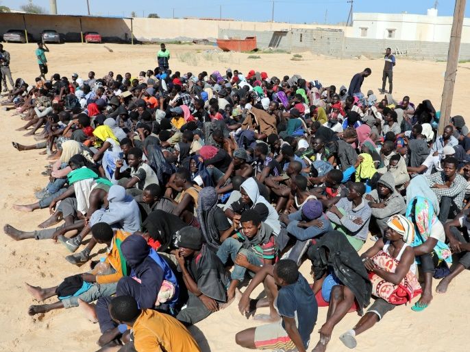 Migrants sit at a detention center in Zuwarah, Libya October 10, 2017. REUTERS/Hani Amara