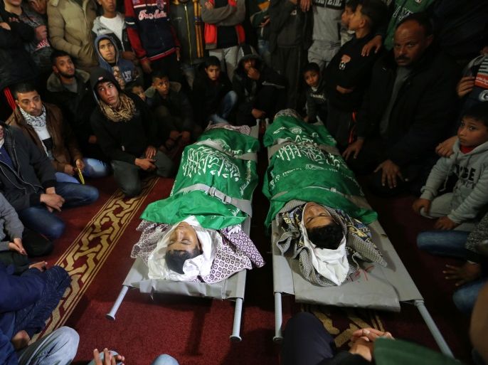 ATTENTION EDITORS - VISUAL COVERAGE OF SCENES OF INJURY OR DEATH Mourners surround bodies of two Palestinian teenagers, during funeral in Rafah in the southern Gaza Strip February 18, 2018. REUTERS/Ibraheem Abu Mustafa TEMPLATE OUT
