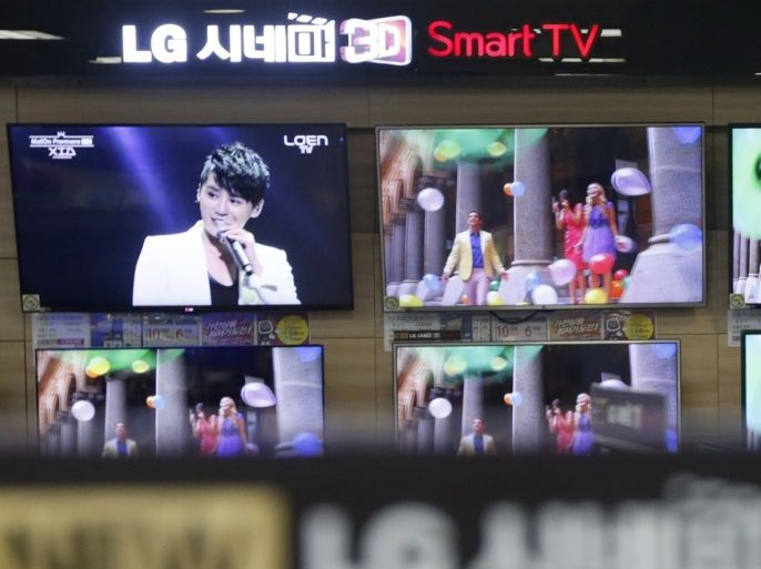 Flat-screen 3D smart TV sets made by LG Electronics, affiliate flat-screen maker LG Display, are displayed at a store in Seoul July 18, 2013. LG Display, a key supplier to Apple, said on Thursday that it was seeking to broaden its smartphone customer base, betting that diversification would bolster its second-half earnings. The move came as the South Korean company posted a forecast-beating 53 percent rise in quarterly operating profit, as stable prices of large-sized T