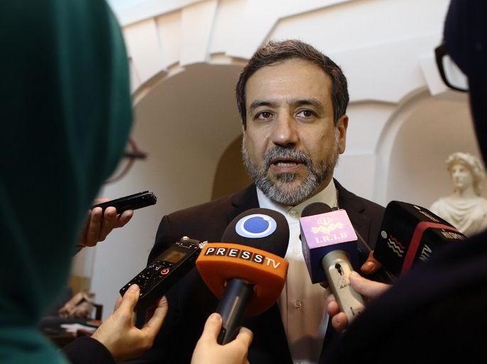 Iran's top nuclear negotiator Abbas Araqchi talks to journalists after meeting senior officials from the United States, Russia, China, Britain, Germany and France in a hotel in Vienna, Austria, October 19, 2015. Abbas said on Monday he expected an historic deal with six world powers on shrinking Tehran's atomic programme in exchange for sanctions relief to be implemented by year-end. REUTERS/Heinz-Peter Bader