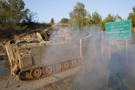 An Israeli soldier travels atop an armoured personnel carrier (APC) ahead of a patrol along Israel's border with Lebanon December 21, 2015. Israel's military said it fired artillery rounds into southern Lebanon on Sunday in response to rockets fired earlier across the border that struck inside Israel. Three rockets fired from Lebanon had struck northern Israel, causing no damage or injuries, hours after a militant leader in the Lebanese group Hezbollah was reported killed in an air strike in Syria. REUTERS/Baz Ratner