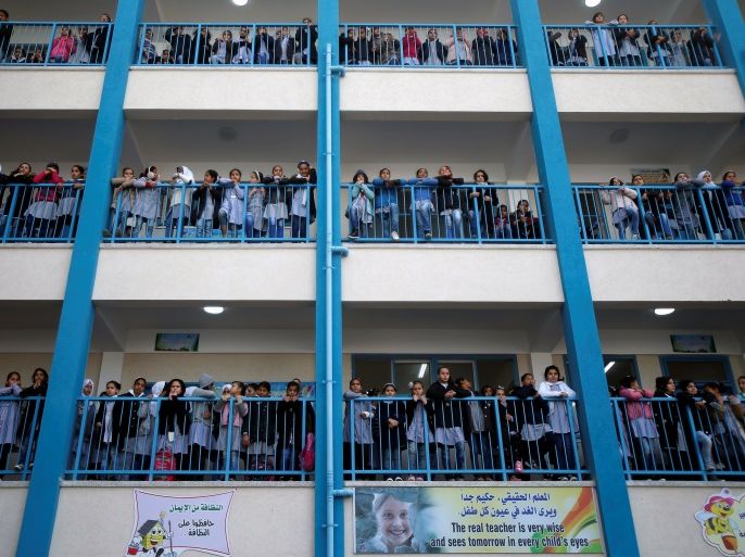 Palestinian schoolchildren watch a news conference by UNRWA Commissioner-General Pierre Krahenbuhl at a UN-run school in Gaza City January 22, 2018. REUTERS/Suhaib Salem