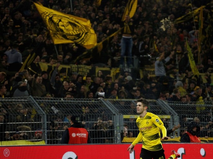 Soccer Football - Bundesliga - Borussia Dortmund vs TSG 1899 Hoffenheim - Signal Iduna Park, Dortmund, Germany - December 16, 2017 Borussia Dortmund’s Christian Pulisic celebrates scoring their second goal REUTERS/Leon Kuegeler DFL RULES TO LIMIT THE ONLINE USAGE DURING MATCH TIME TO 15 PICTURES PER GAME. IMAGE SEQUENCES TO SIMULATE VIDEO IS NOT ALLOWED AT ANY TIME. FOR FURTHER QUERIES PLEASE CONTACT DFL DIRECTLY AT + 49 69 650050